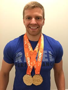 Roman Soboliev, jiu jitsu athlete, with his gold medals