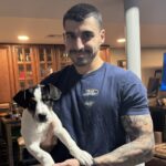 Mark Giuliano holding a dog